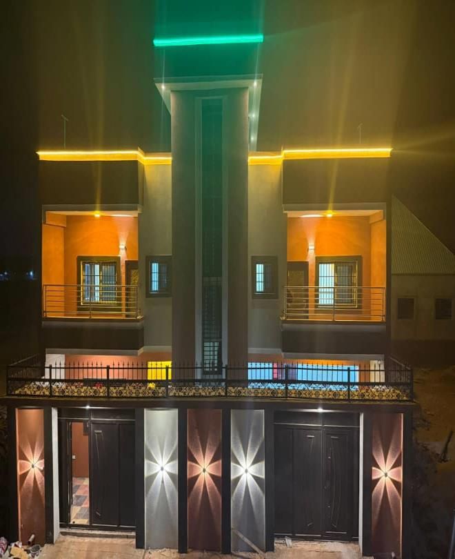 G+2 residential building lit up at night