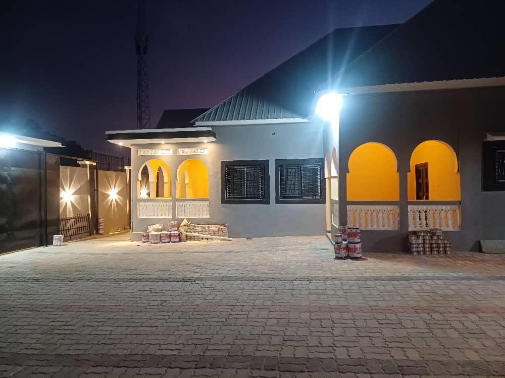 Residential compound with facade lighting at night